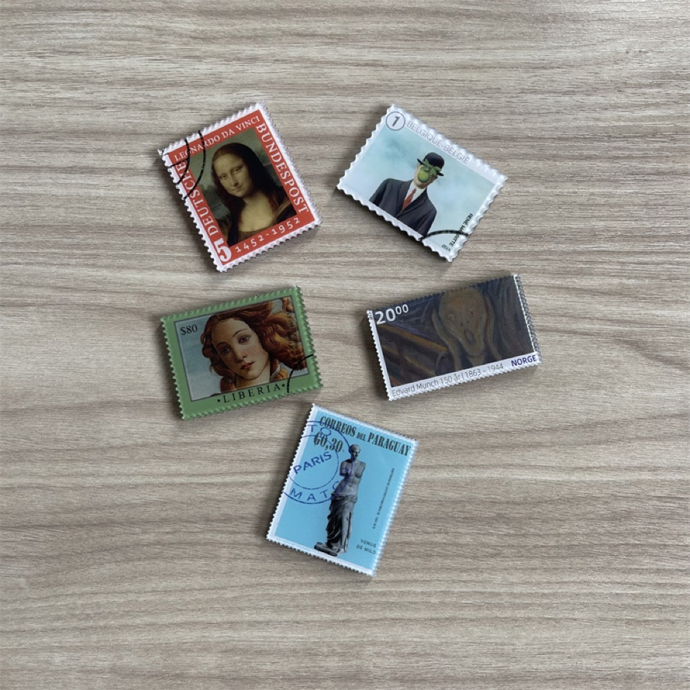 Fridge magnets die-cut like perforated postage stamps, each printed with a famous painting