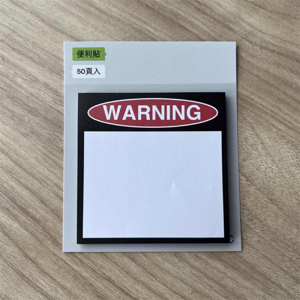 Sticky note pad with a printed cover, shrink-wrapped with a backing card